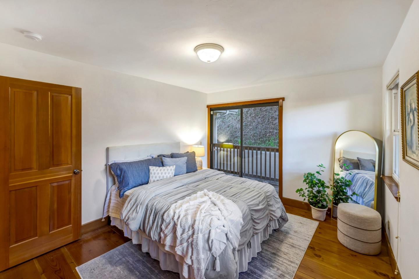 1166 Josselyn Canyon Road Monterey, CA 93940 - Photo 12 of 17 a bedroom with a bed and a window