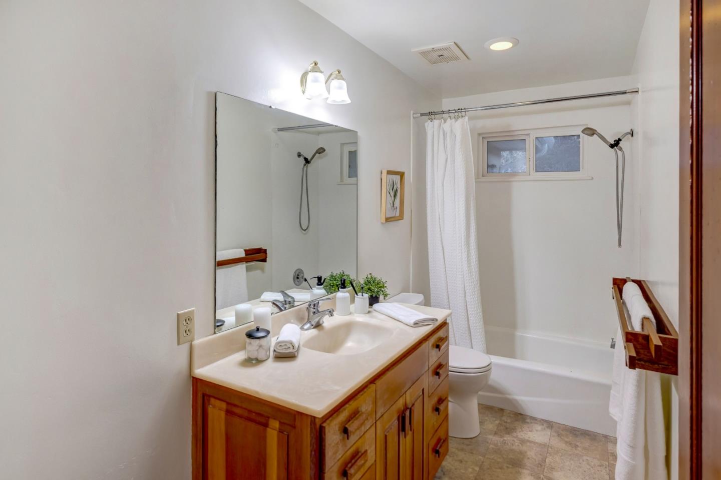 1166 Josselyn Canyon Road Monterey, CA 93940 - Photo 13 of 17 a bathroom with a sink a toilet and shower