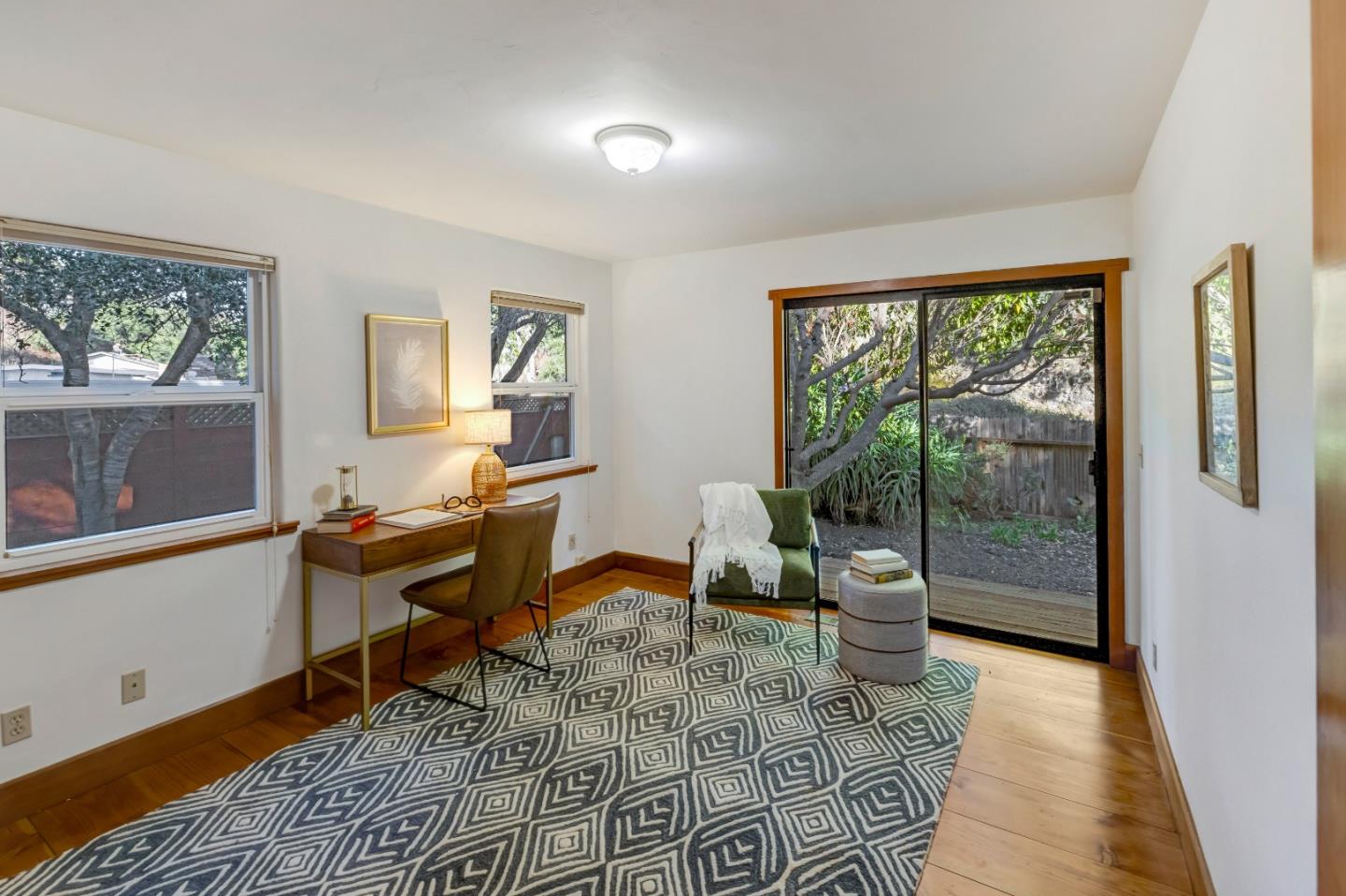 1166 Josselyn Canyon Road Monterey, CA 93940 - Photo 14 of 17 a view of a workspace with wooden floor and a window
