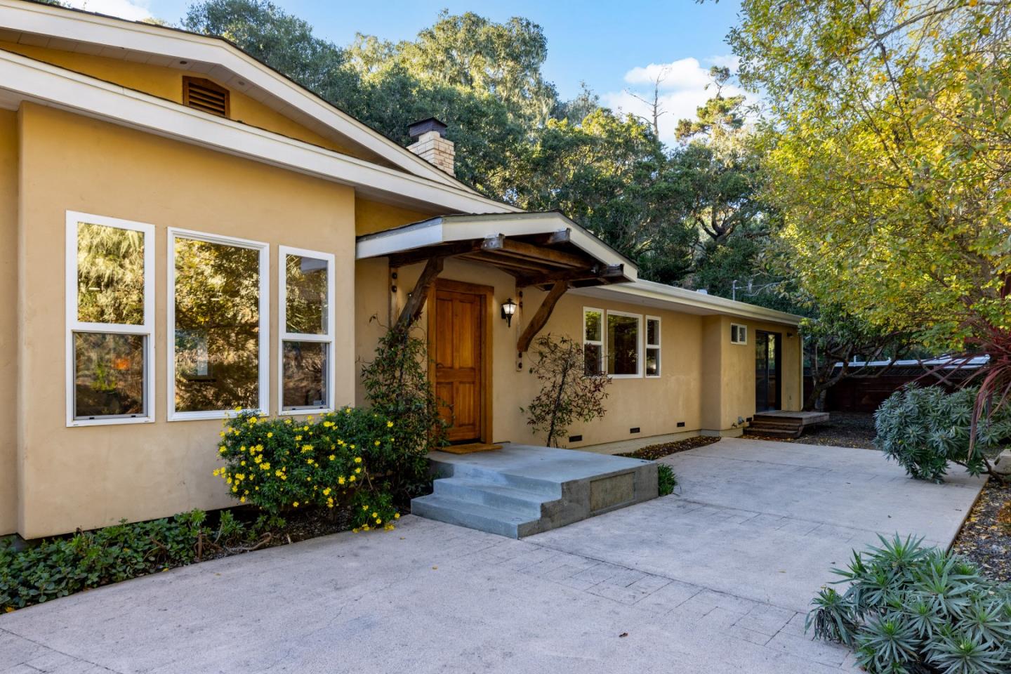 1166 Josselyn Canyon Road Monterey, CA 93940 - Photo 2 of 17 a house with trees in the background