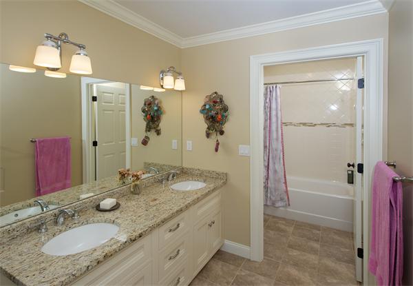 32 Winter Street Weston, MA 02493 - Photo 12 of 23 a bathroom with a granite countertop tub sink and mirror