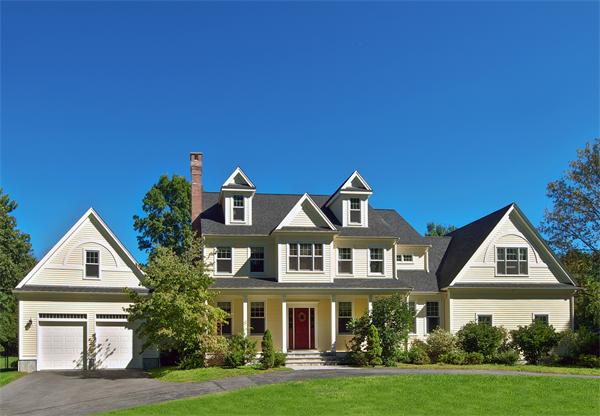32 Winter Street Weston, MA 02493 - Photo 2 of 23 a front view of a house with a yard