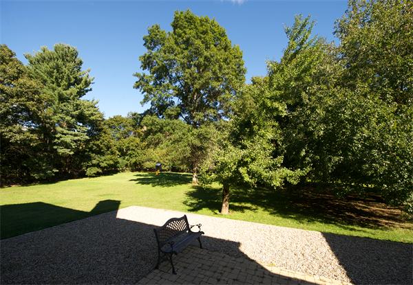 32 Winter Street Weston, MA 02493 - Photo 21 of 23 a view of a lake with a yard
