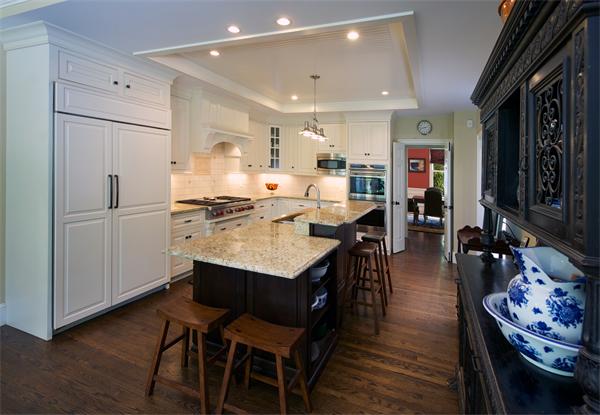 32 Winter Street Weston, MA 02493 - Photo 5 of 23 a kitchen with stainless steel appliances granite countertop a table chairs and a refrigerator