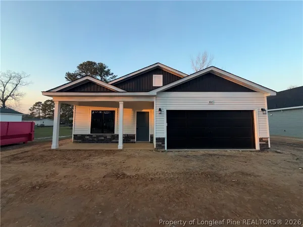 a front view of a house with a garage