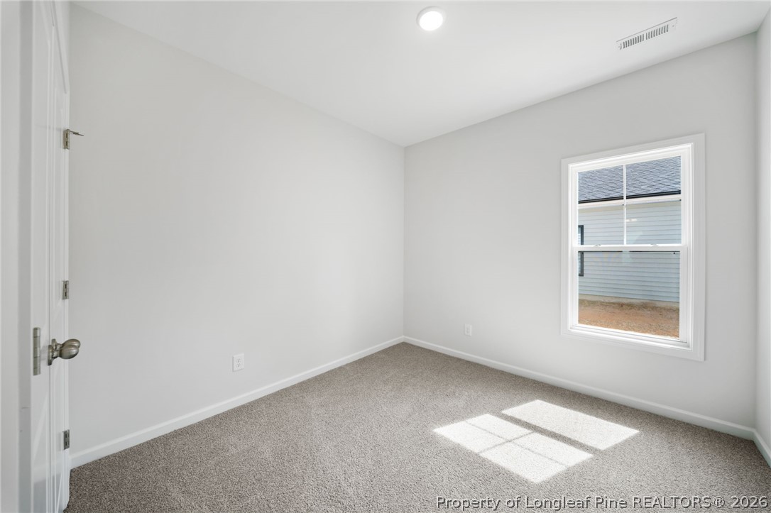4043 Church Street Wade, NC 28395 - Photo 12 of 28 an empty room with a window