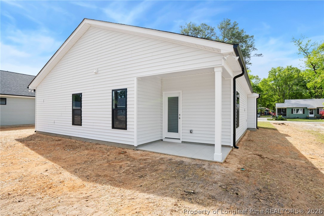 4043 Church Street Wade, NC 28395 - Photo 25 of 28 a view of a house with a backyard
