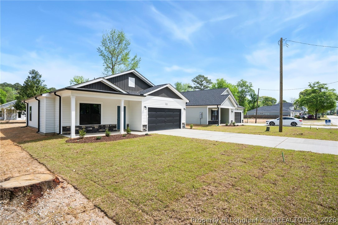4043 Church Street Wade, NC 28395 - Photo 28 of 28 a view of a house with swimming pool and a porch with furniture