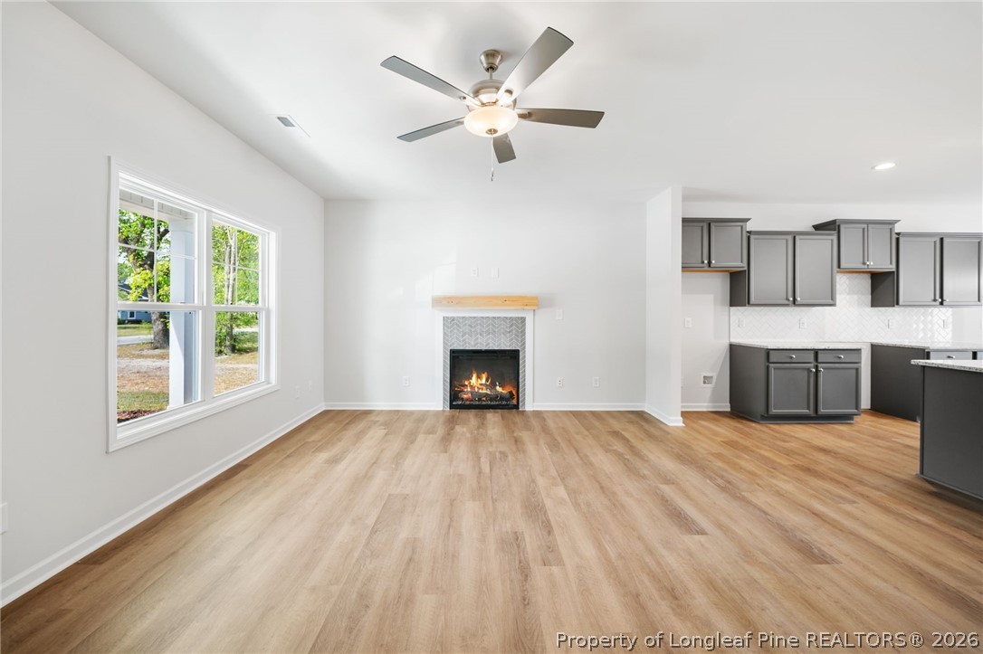 4043 Church Street Wade, NC 28395 - Photo 3 of 28 a view of an empty room with a fireplace and a window