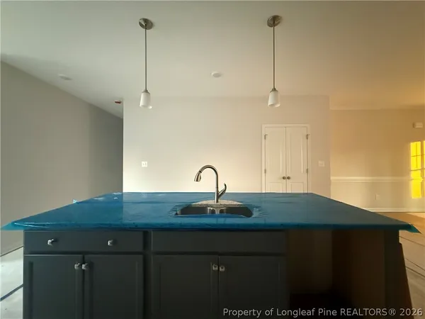 a kitchen with a sink and cabinets