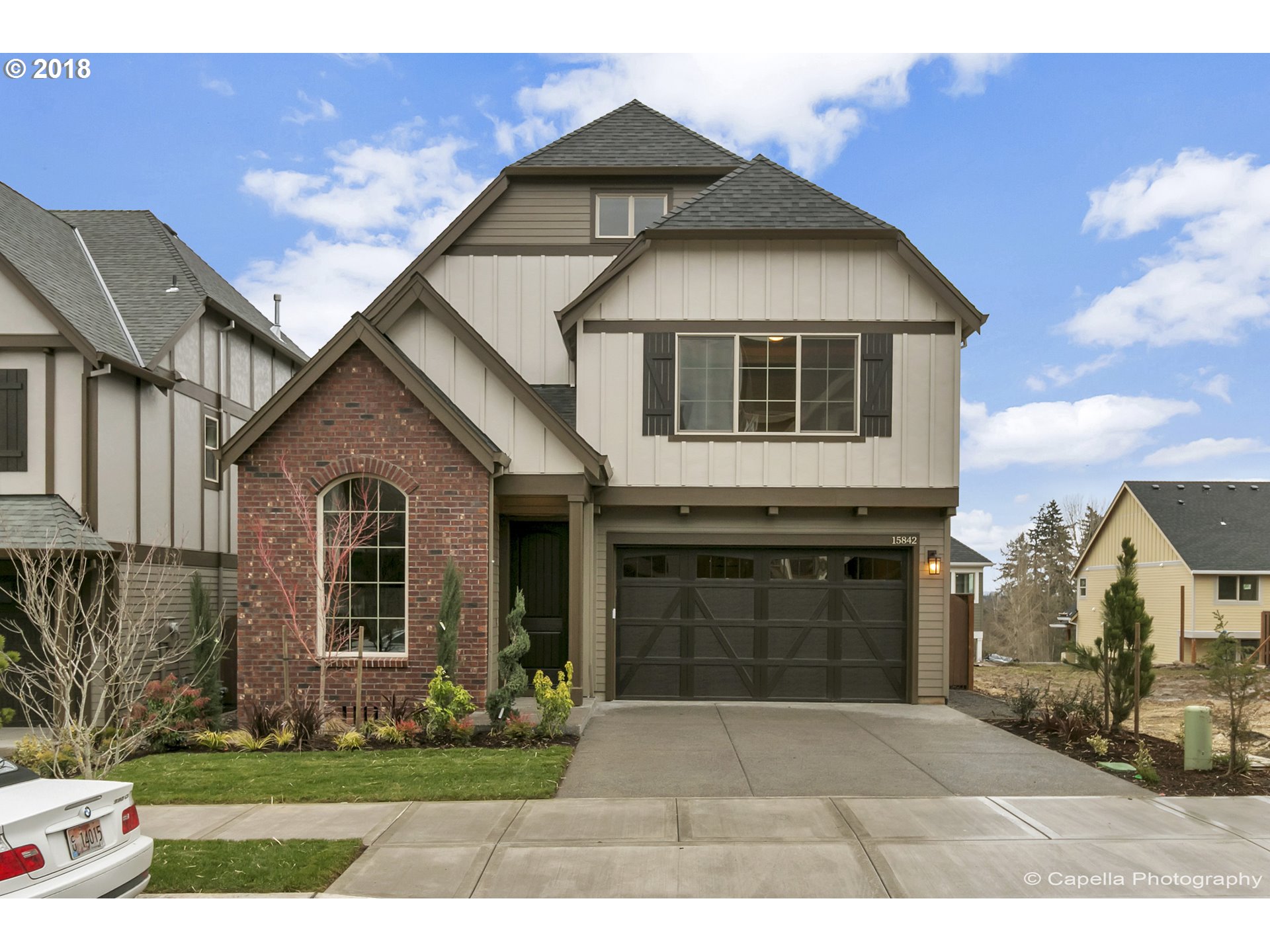 4178 Northwest Ashbrook Drive Portland, OR 97229 - Photo 1 of 20 a front view of a house with garden