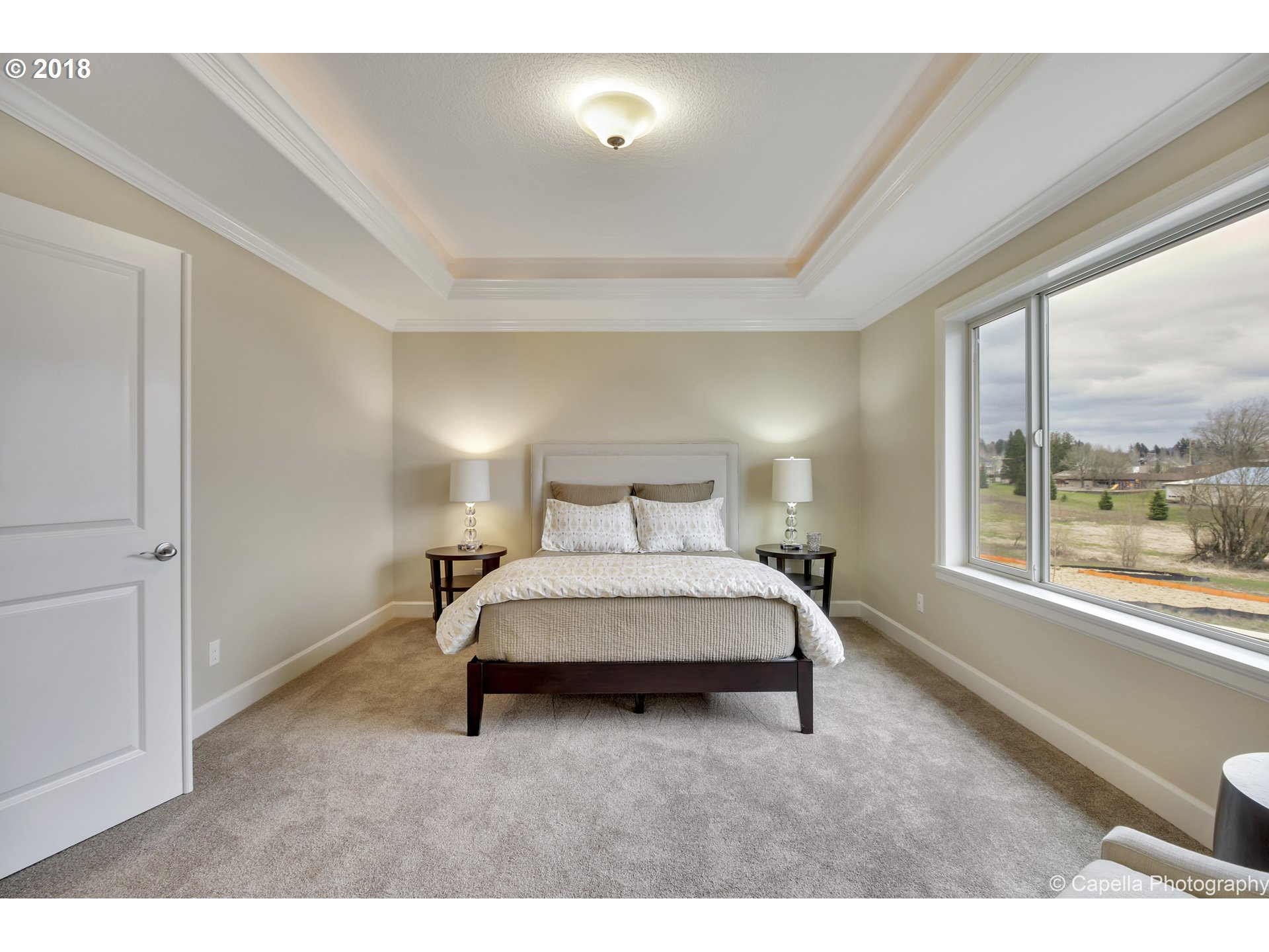 4178 Northwest Ashbrook Drive Portland, OR 97229 - Photo 11 of 20 a living room with a bed furniture and a large window