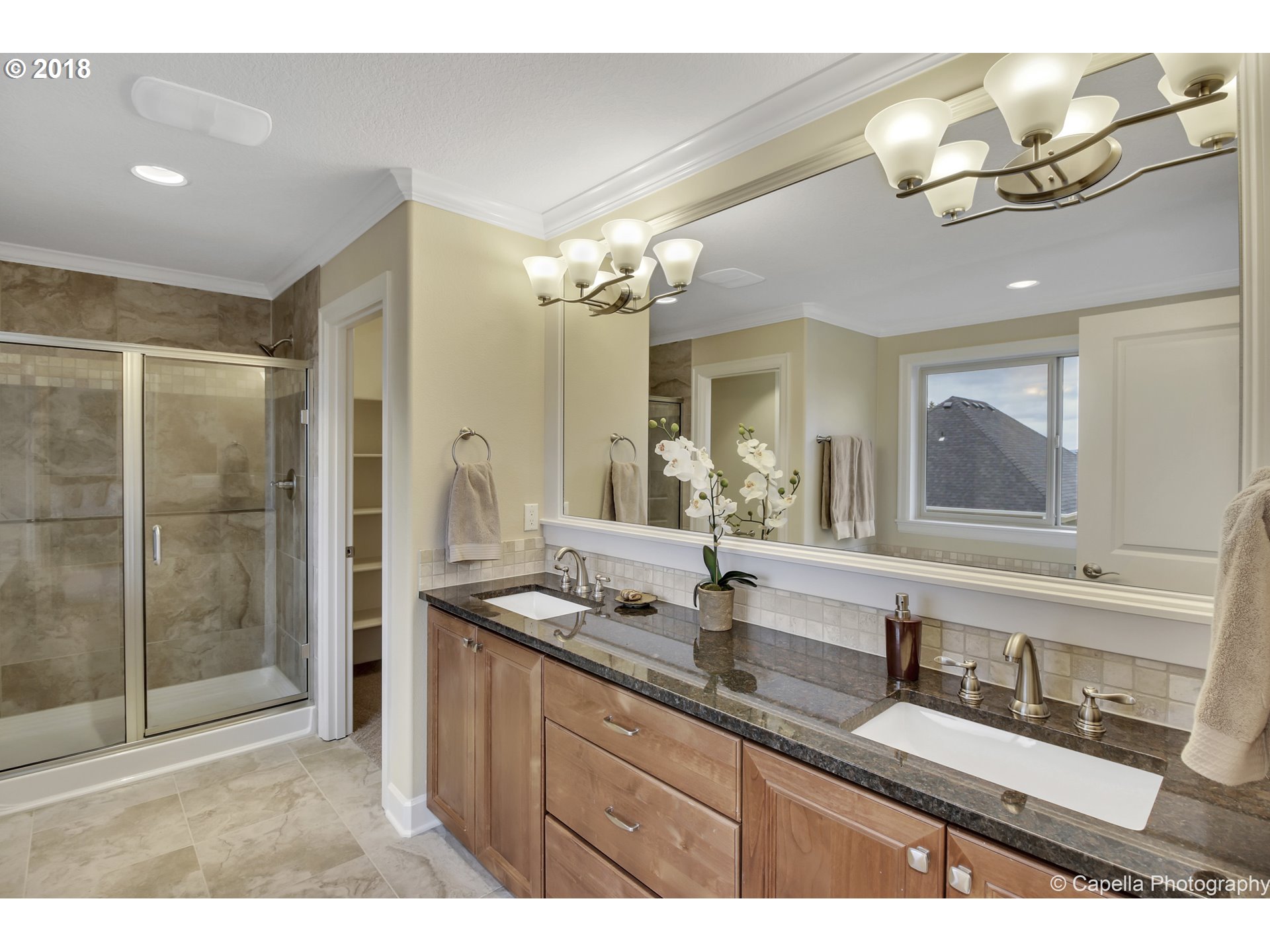 4178 Northwest Ashbrook Drive Portland, OR 97229 - Photo 13 of 20 a bathroom with a sink double vanity and a mirror