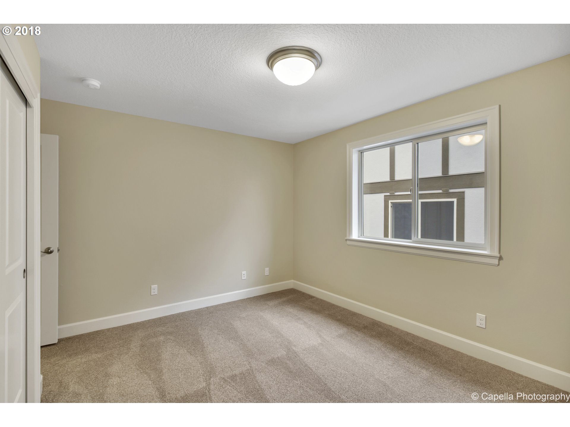 4178 Northwest Ashbrook Drive Portland, OR 97229 - Photo 15 of 20 a view of an empty room with a window