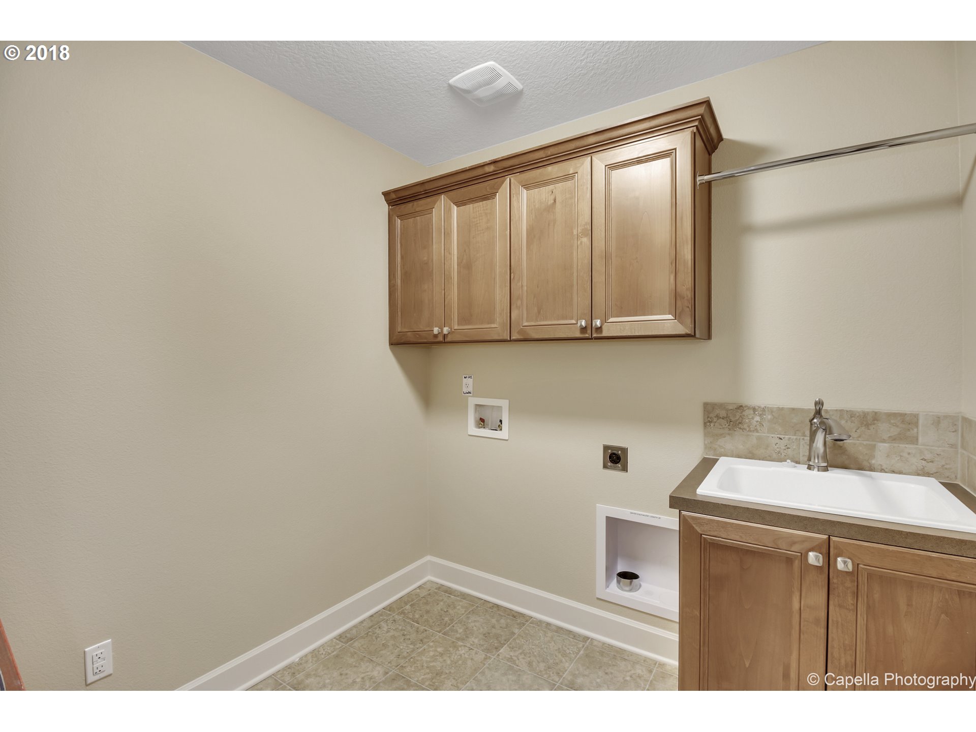 4178 Northwest Ashbrook Drive Portland, OR 97229 - Photo 20 of 20 a bathroom with a sink vanity and mirror
