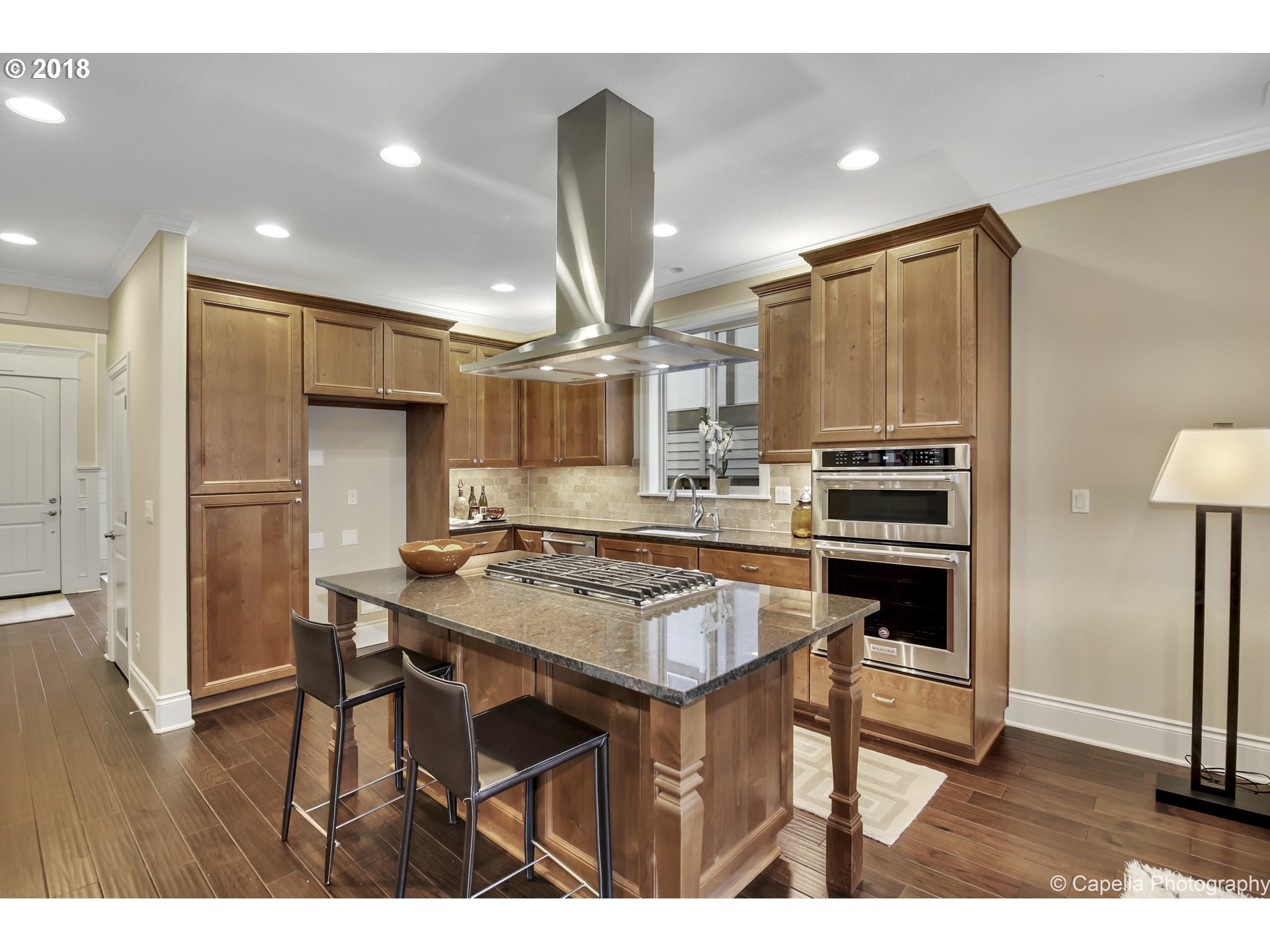 4178 Northwest Ashbrook Drive Portland, OR 97229 - Photo 3 of 20 a kitchen with stainless steel appliances a stove a refrigerator and a refrigerator