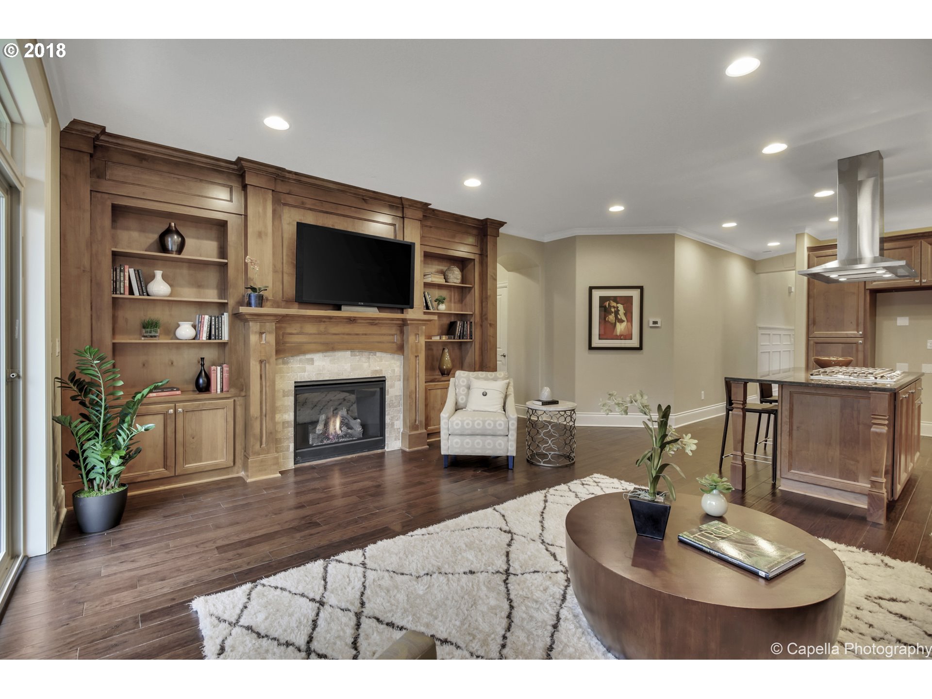 4178 Northwest Ashbrook Drive Portland, OR 97229 - Photo 5 of 20 a living room with furniture a flat screen tv and a fireplace
