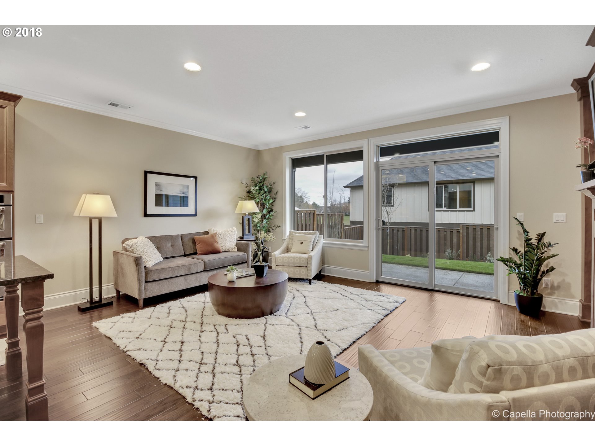 4178 Northwest Ashbrook Drive Portland, OR 97229 - Photo 7 of 20 a living room with furniture and a large window