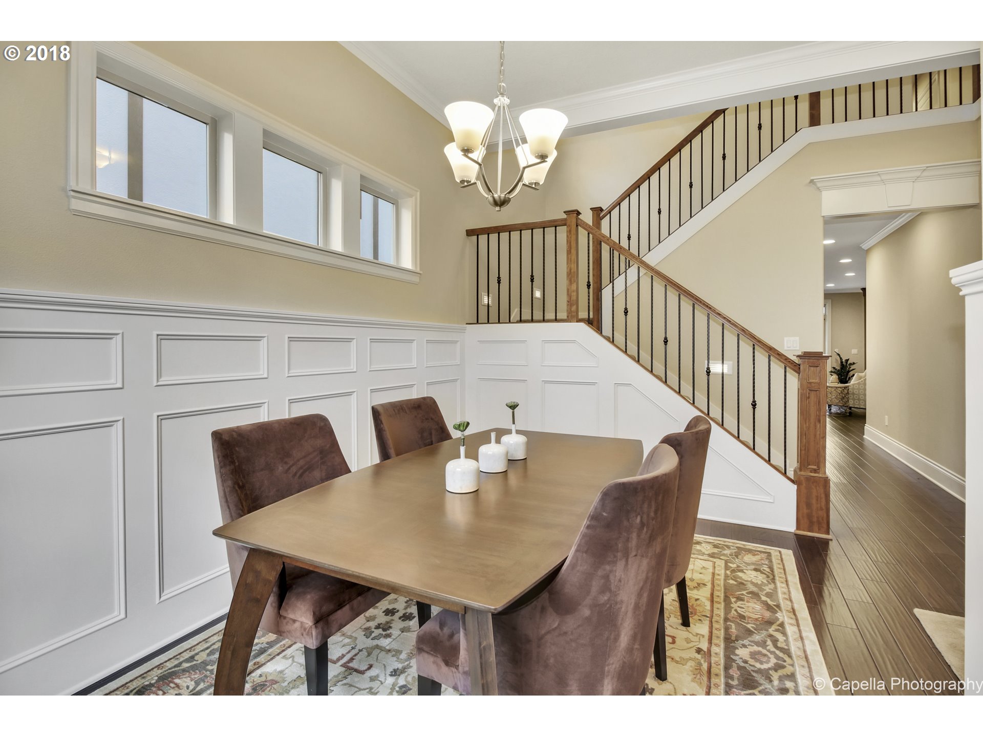 4178 Northwest Ashbrook Drive Portland, OR 97229 - Photo 8 of 20 a view of a dining room with furniture and a chandelier