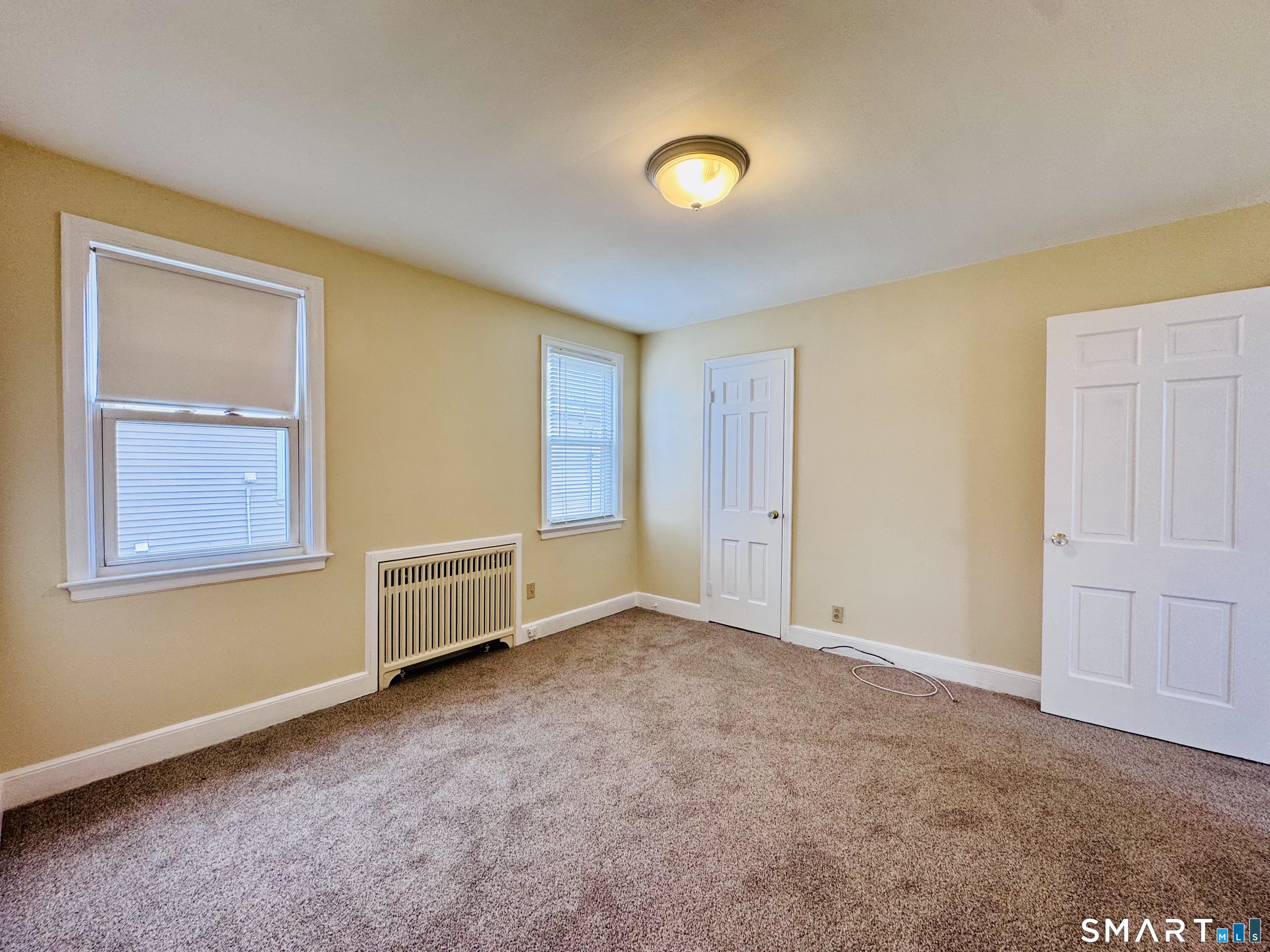 47 Clover Street Stratford, CT 06614 - Photo 9 of 14 an empty room with windows