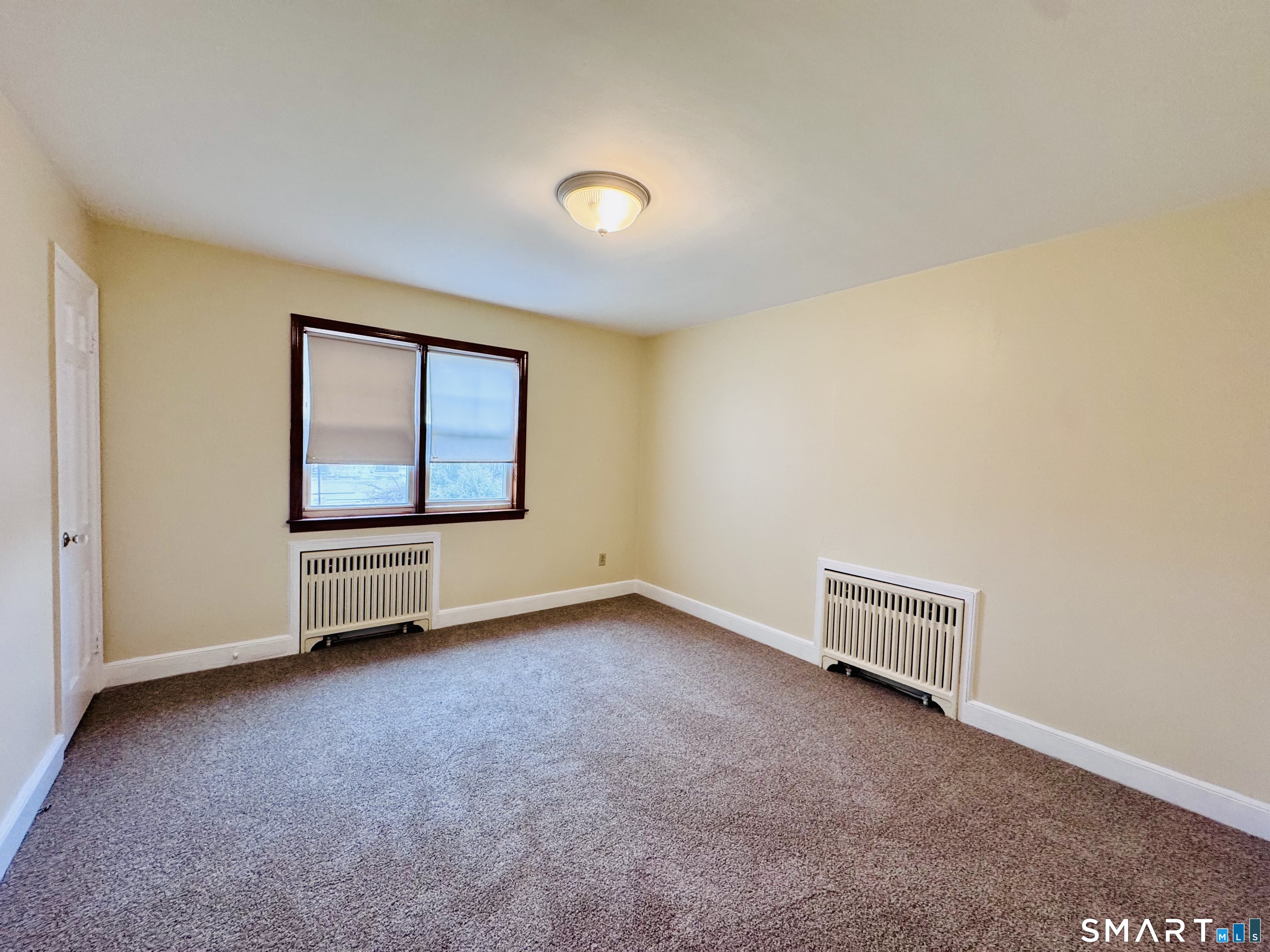 47 Clover Street Stratford, CT 06614 - Photo 10 of 14 an empty room with windows