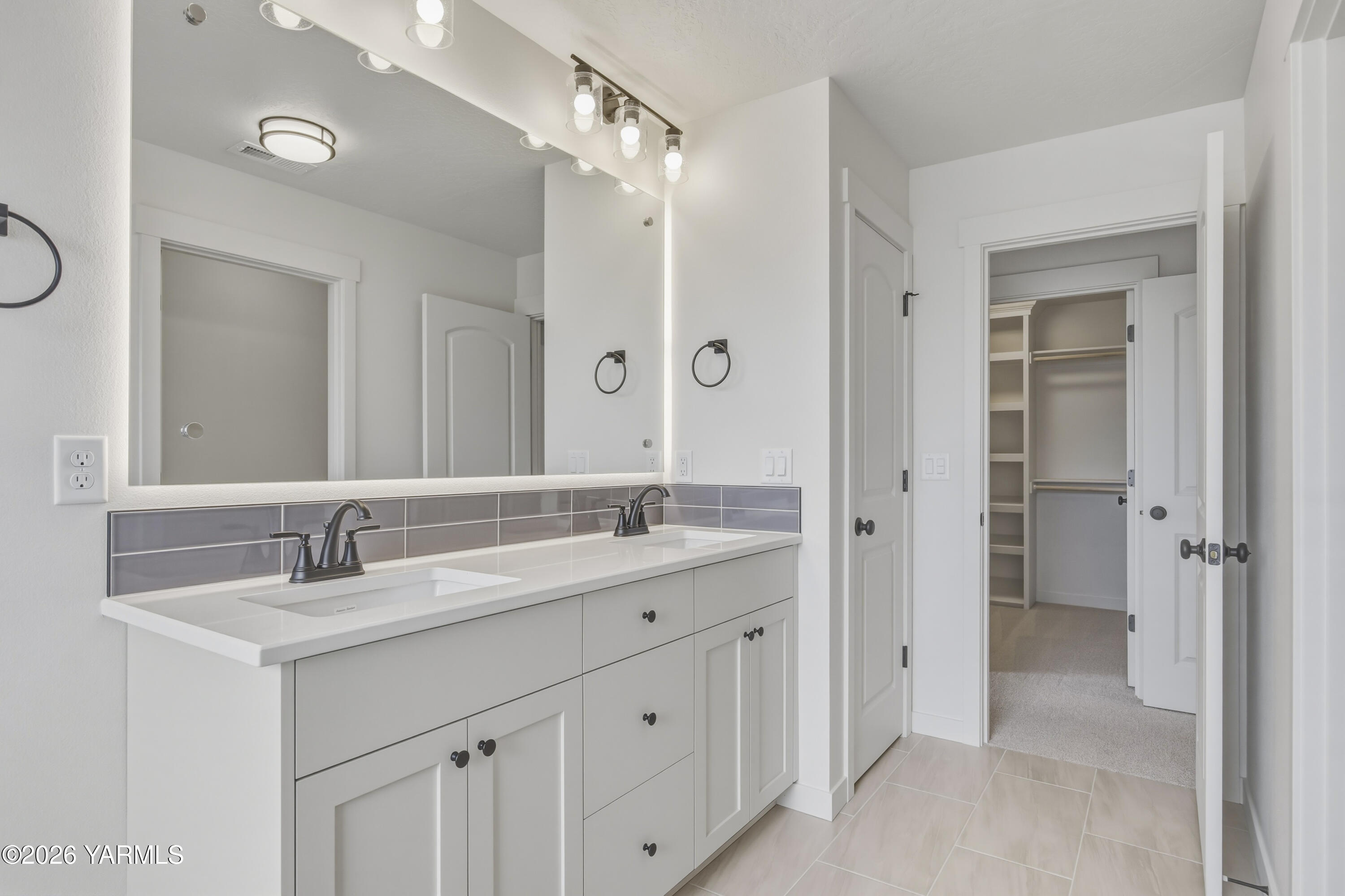 215 Packer Street Prosser, WA 99350 - Photo 26 of 45 a bathroom with a granite countertop sink mirror and a