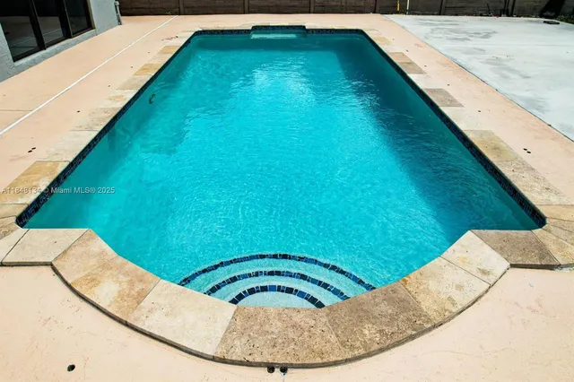 a view of a swimming pool from a balcony