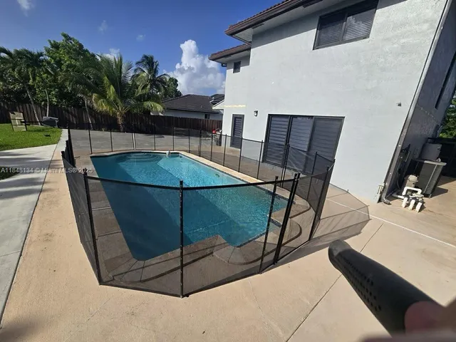 a view of backyard with green space