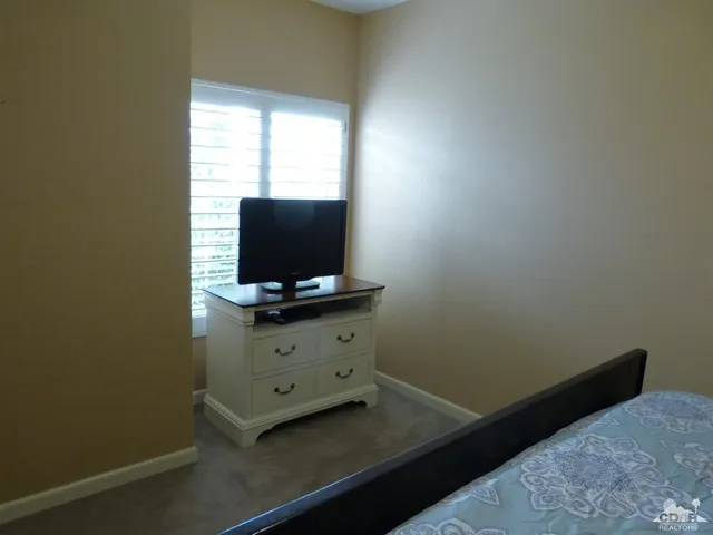 a room with furniture and flat screen tv