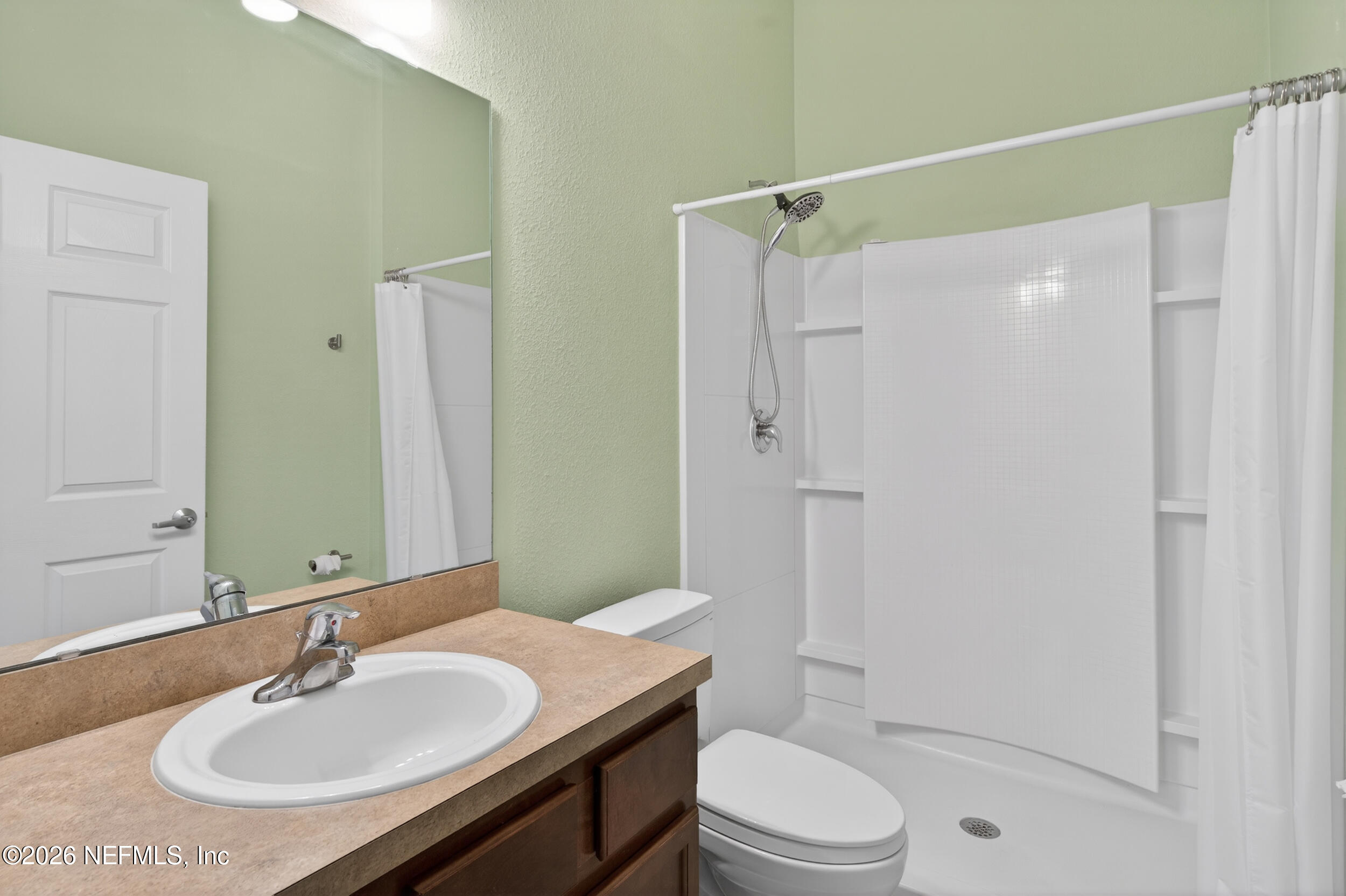 319 Golden Lake Loop St. Augustine, FL 32084 - Photo 7 of 15 a bathroom with a sink toilet and shower