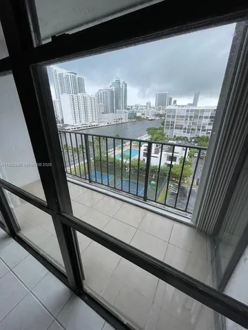 a view of an empty room with a window