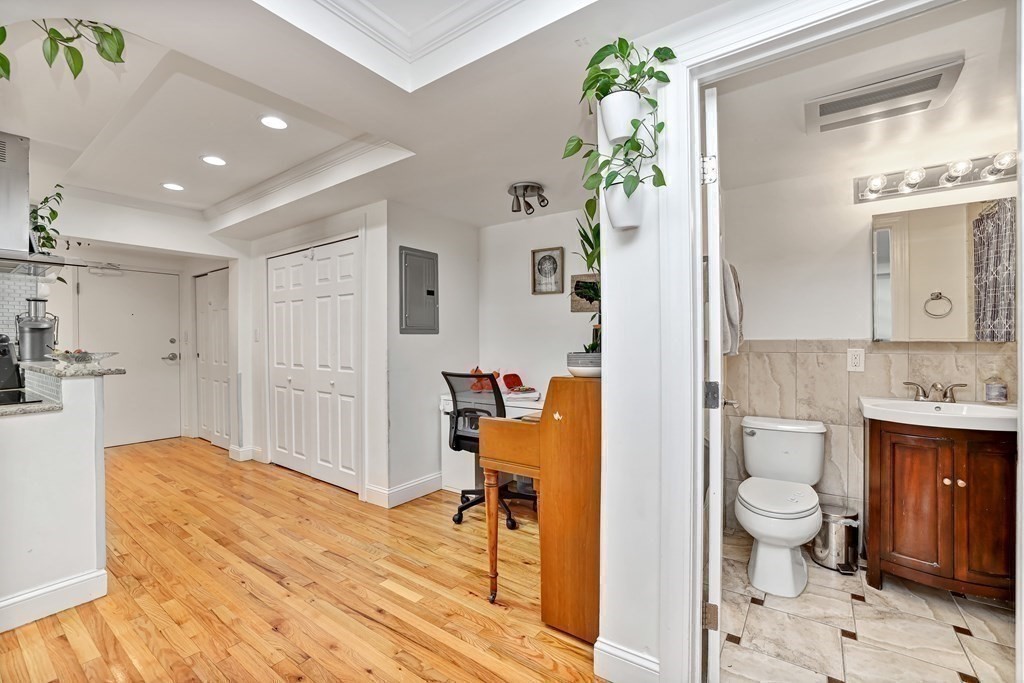 16 Addington Road, Unit 23 Brookline, MA 02445 - Photo 12 of 21 a spacious bathroom with a granite countertop sink a toilet and shower