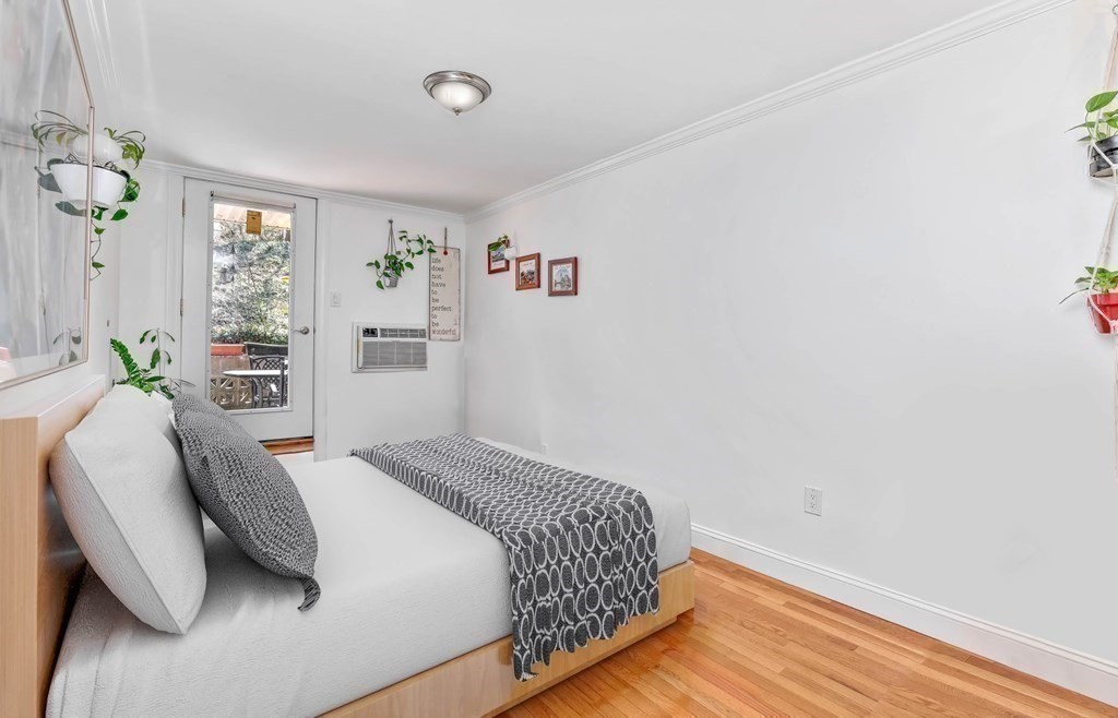 16 Addington Road, Unit 23 Brookline, MA 02445 - Photo 15 of 21 a bedroom with a bed and window