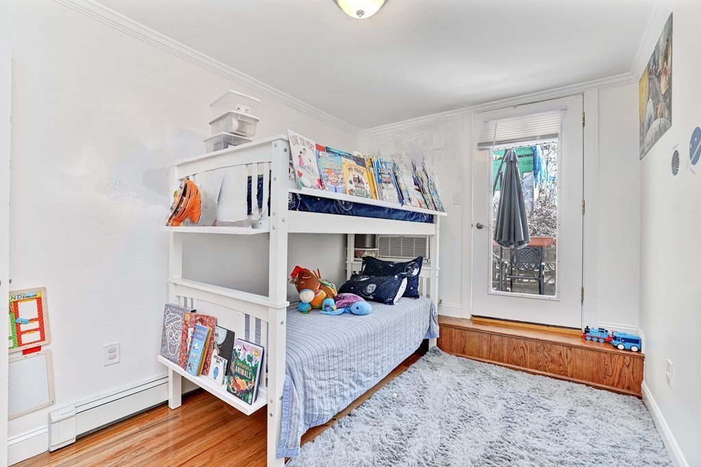 16 Addington Road, Unit 23 Brookline, MA 02445 - Photo 16 of 21 a bed room with furniture and closet