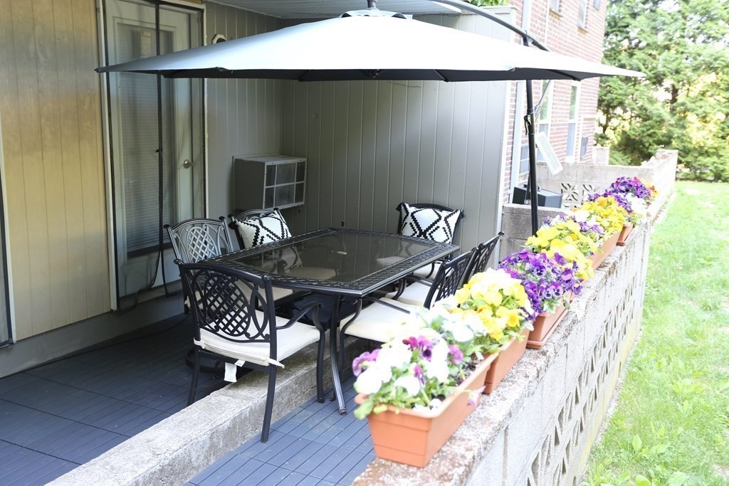16 Addington Road, Unit 23 Brookline, MA 02445 - Photo 19 of 21 a outdoor dining area with furniture