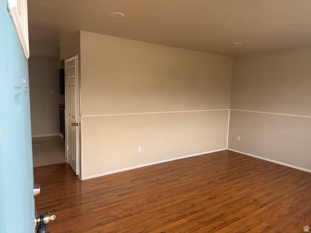 874 770 South Tooele, UT 84074 - Photo 4 of 19 Spacious room featuring wood-finish flooring, wainscoting, recessed lighting, and a light-colored wall palette