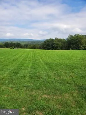 a view of an outdoor space and a yard