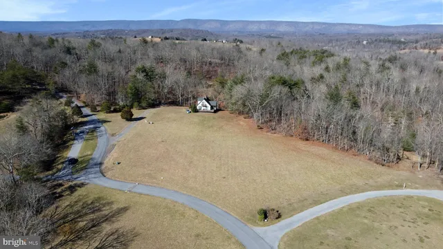 an aerial view of residential house and outdoor space