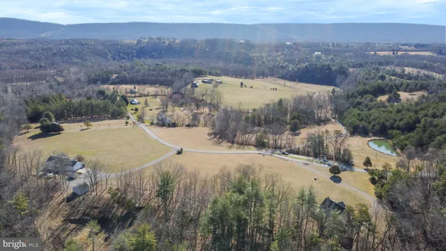 a view of a swimming pool with a yard