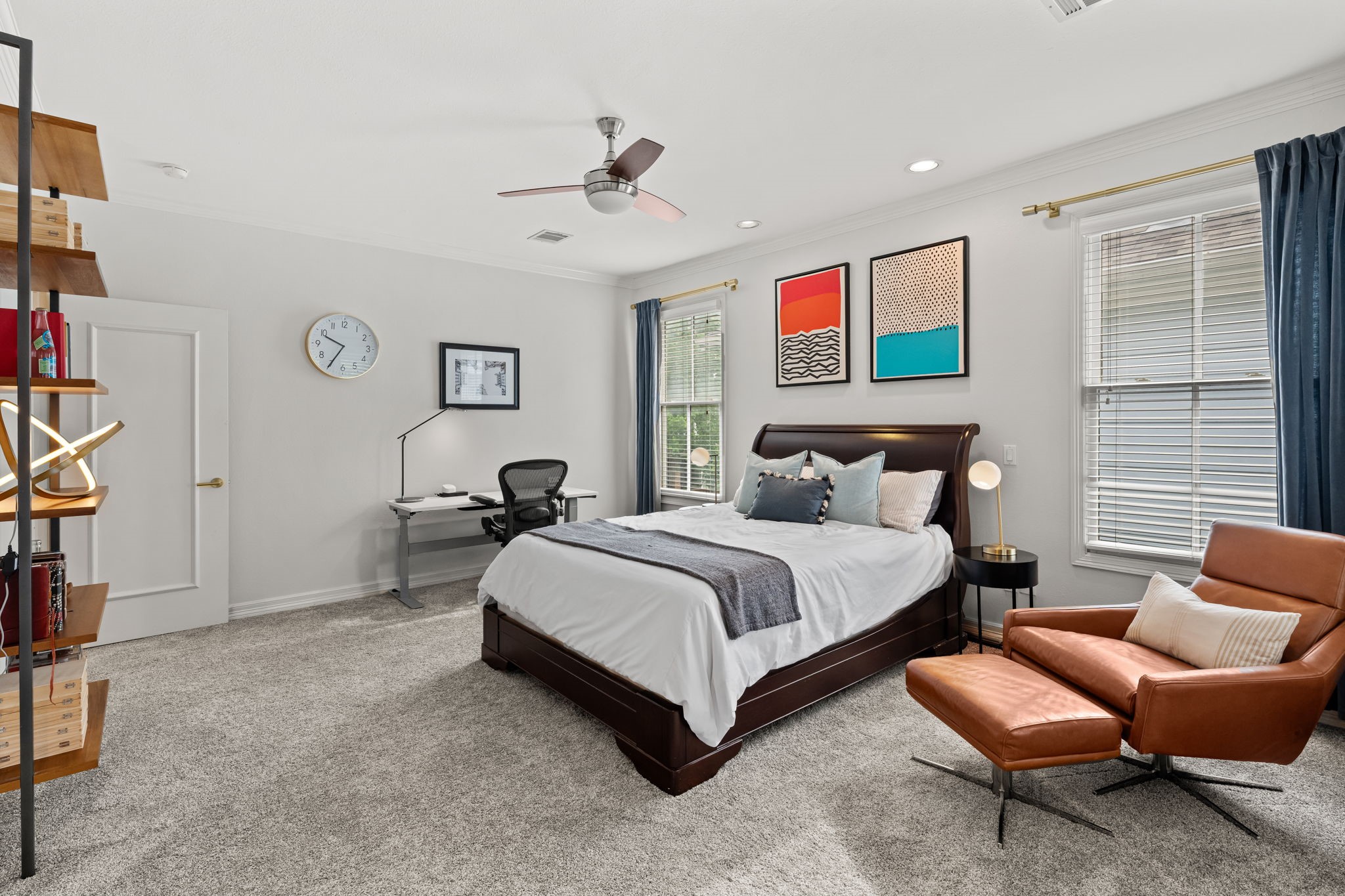 520 Oxford Street, Unit F Houston, TX 77007 - Photo 38 of 38 The spacious primary bedroom is bathed in natural light from multiple windows and features plush new carpet, crown molding, and recessed lighting. The generous floor plan comfortably accommodates a bedroom, sitting area, and workspace, making it a true private retreat.