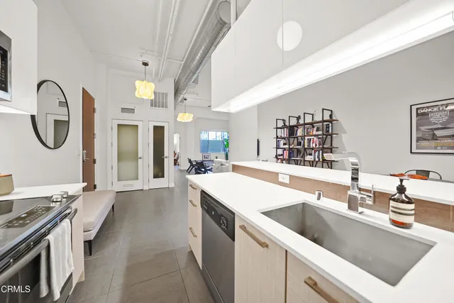 a living room with furniture fireplace and a window