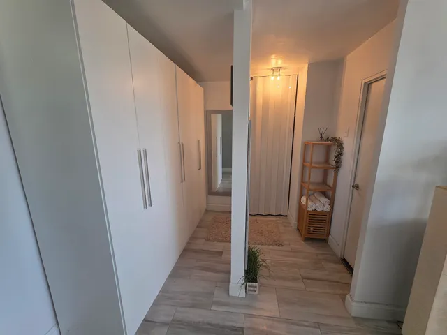 a view of a kitchen from the hallway