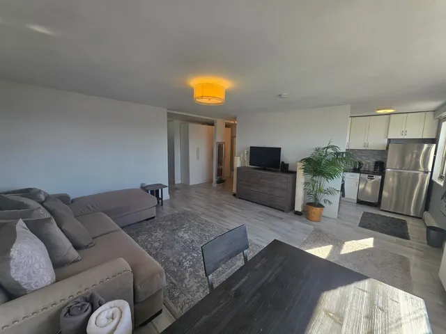 a view of a hallway with potted plants