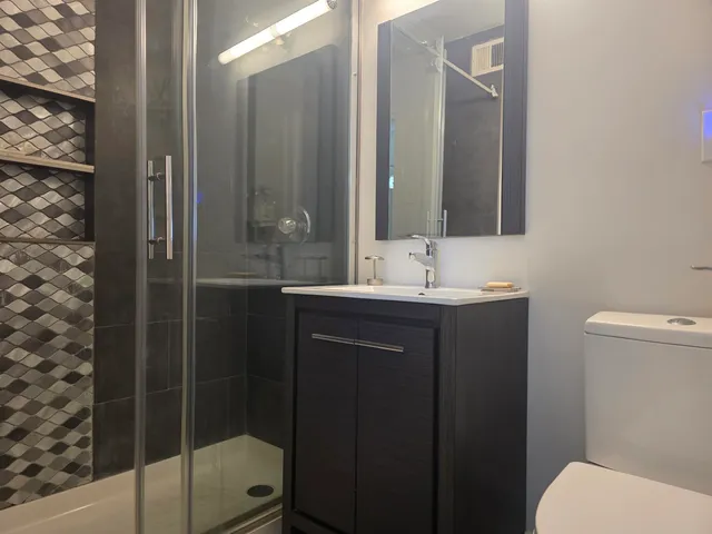 a view of a lake with tall buildings