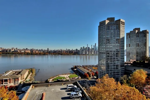 a view of a swimming pool with outdoor seating