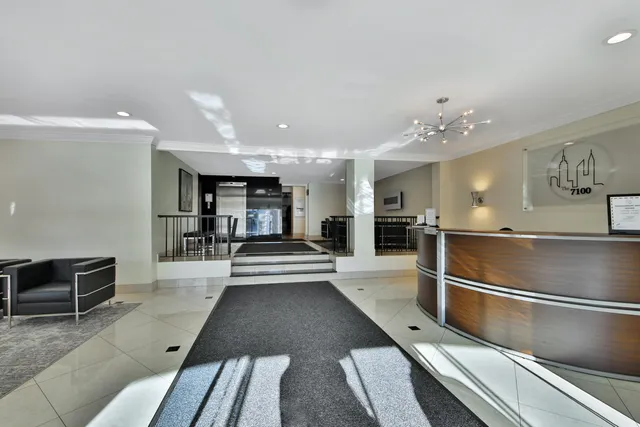 a view of a living room and kitchen