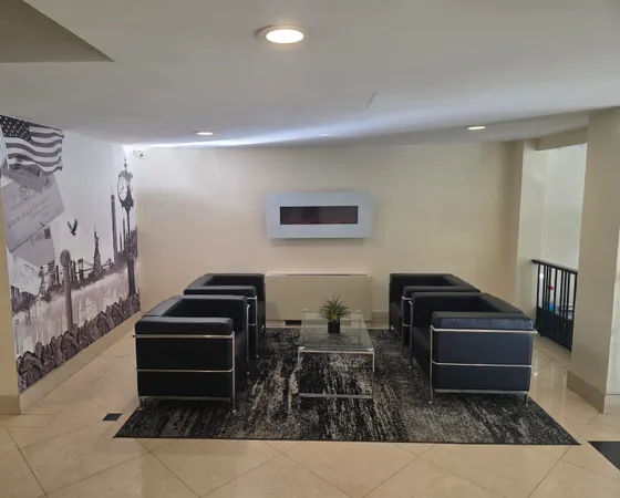 a living room with furniture and a piano