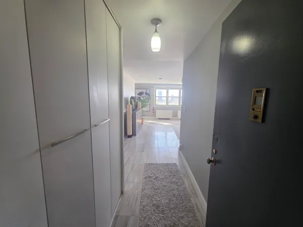 a view of entryway with wooden floor
