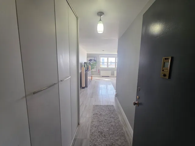 a view of entryway with wooden floor