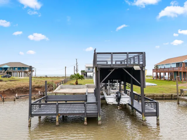 a kitchen with a table chairs sink and cabinets